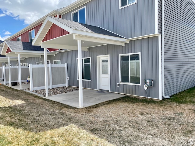 22 E Cedar Ln, Malad City, ID 83252 - back of house featuring a lawn and a patio area