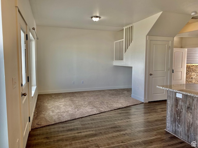 22 E Cedar Ln, Malad City, ID 83252 - unfurnished dining area with baseboards, dark wood finished floors, and stairway