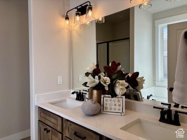 584 N 510 E, Smithfield, UT 84335 - bathroom with a sink, a bath, a stall shower, and double vanity
