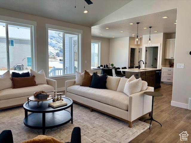 584 N 510 E, Smithfield, UT 84335 - living room with a ceiling fan, vaulted ceiling, baseboards, recessed lighting, and light wood-style flooring