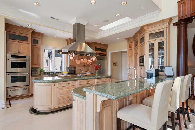 5678 E Twin Creek Rd, Emigration Canyon, UT 84108 - kitchen with built in appliances, a warming drawer, a sink, a peninsula, and ornate columns