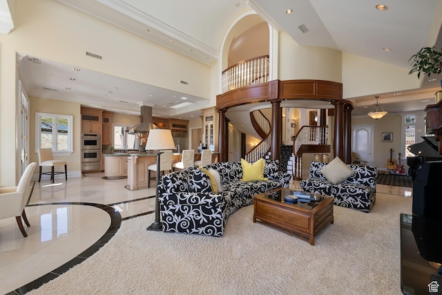 5678 E Twin Creek Rd, Emigration Canyon, UT 84108 - living area featuring ornate columns, crown molding, inlaid floor details, recessed lighting, and a towering ceiling