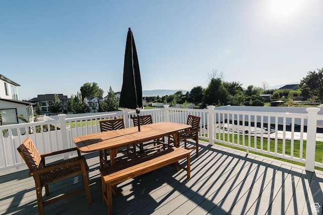 wooden terrace featuring outdoor dining space