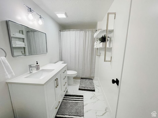 full bathroom with a textured ceiling, baseboards, marble finish floor, toilet, and vanity