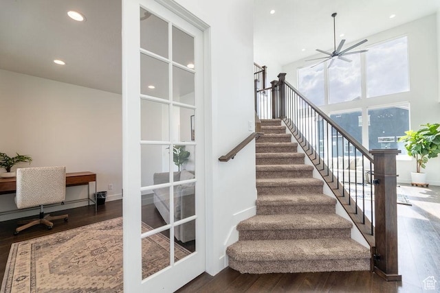 stairs with a ceiling fan, recessed lighting, baseboards, and wood finished floors