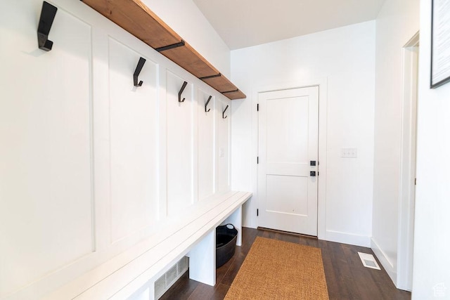 mudroom featuring baseboards and dark wood-style flooring