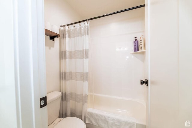 bathroom with toilet and shower / bath combination with curtain