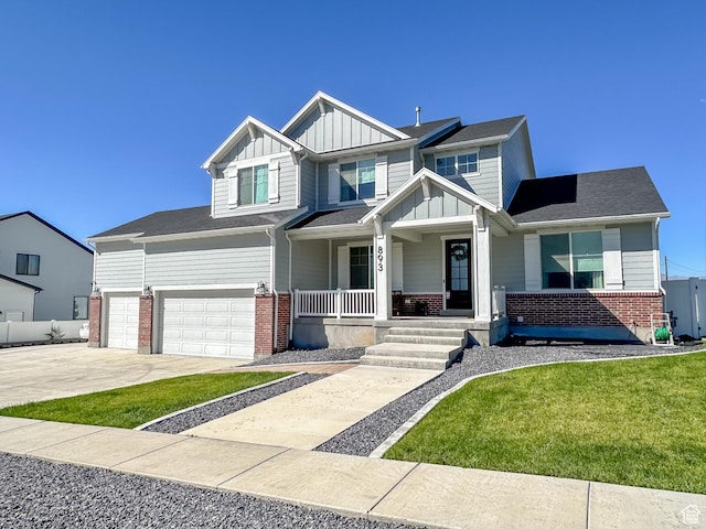 craftsman-style house featuring covered porch, board and batten siding, and brick siding