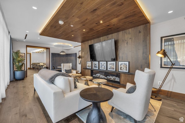2303 Deer Hollow Rd Unit 1333/4, Park City, UT 84060 - living area featuring baseboards, recessed lighting, wood finished floors, wooden ceiling, and wood walls