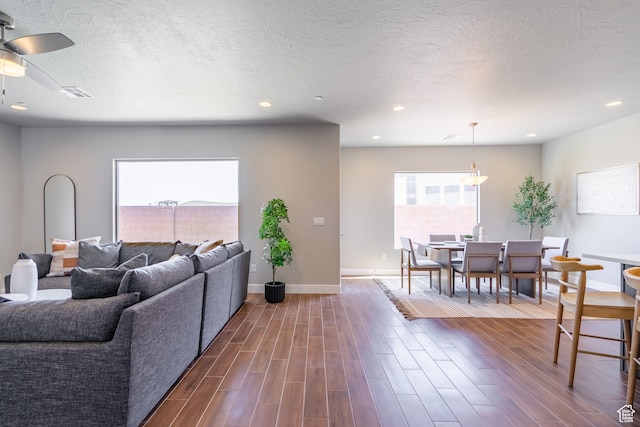 278 N 2020 W, Hurricane, UT 84737 - living room featuring a textured ceiling, dark wood-type flooring, and ceiling fan