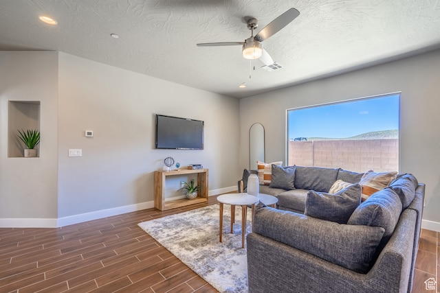278 N 2020 W, Hurricane, UT 84737 - living room with a textured ceiling, ceiling fan, and dark hardwood / wood-style flooring