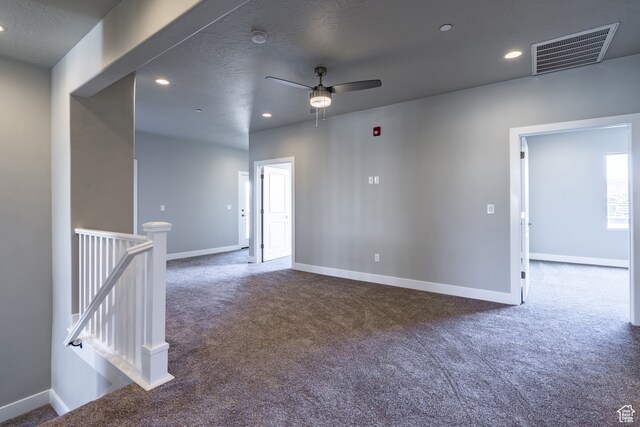 278 N 2020 W, Hurricane, UT 84737 - empty room with a textured ceiling, ceiling fan, and dark colored carpet