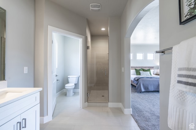 278 N 2020 W, Hurricane, UT 84737 - bathroom featuring vanity, toilet, and a shower with shower door