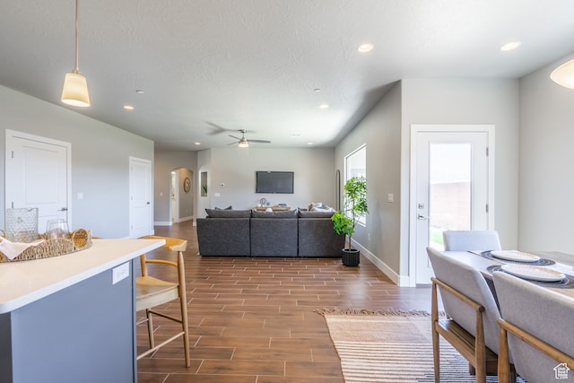 278 N 2020 W, Hurricane, UT 84737 - living room with a textured ceiling, dark wood-type flooring, and ceiling fan
