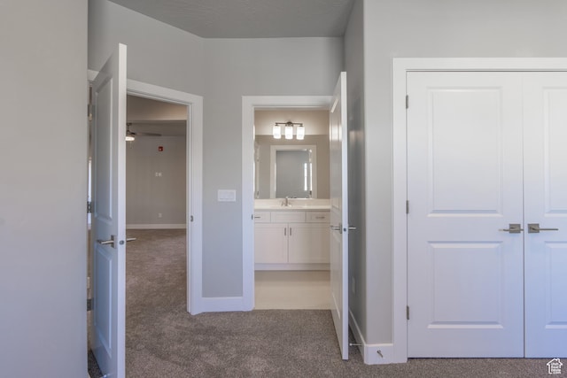 278 N 2020 W, Hurricane, UT 84737 - hallway with light carpet and a sink