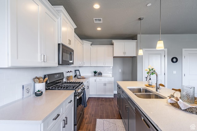 278 N 2020 W, Hurricane, UT 84737 - kitchen featuring stainless steel appliances, dark wood finished floors, white cabinets, and recessed lighting