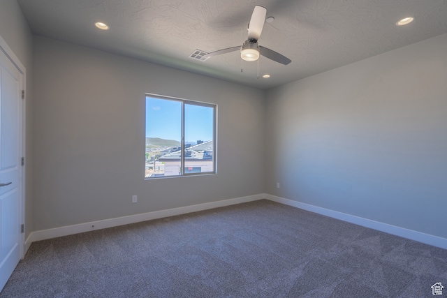 278 N 2020 W, Hurricane, UT 84737 - spare room with a mountain view, a textured ceiling, carpet, and ceiling fan