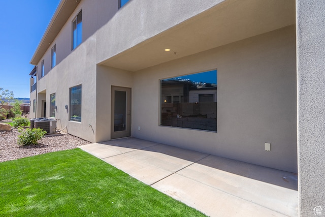 278 N 2020 W, Hurricane, UT 84737 - back of property with a patio, a lawn, and central air condition unit