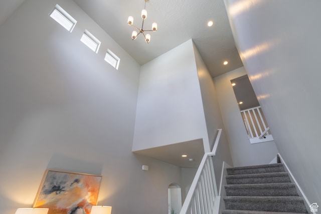 278 N 2020 W, Hurricane, UT 84737 - staircase with high vaulted ceiling and a chandelier