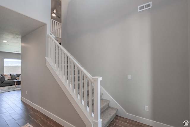 278 N 2020 W, Hurricane, UT 84737 - stairway featuring a textured ceiling and hardwood / wood-style floors