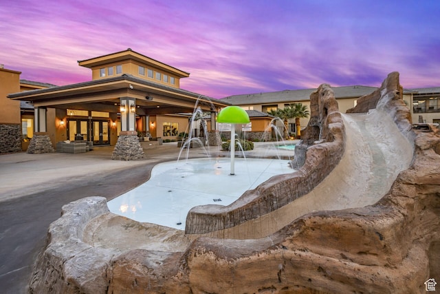 278 N 2020 W, Hurricane, UT 84737 - pool at dusk featuring a patio area and pool water feature