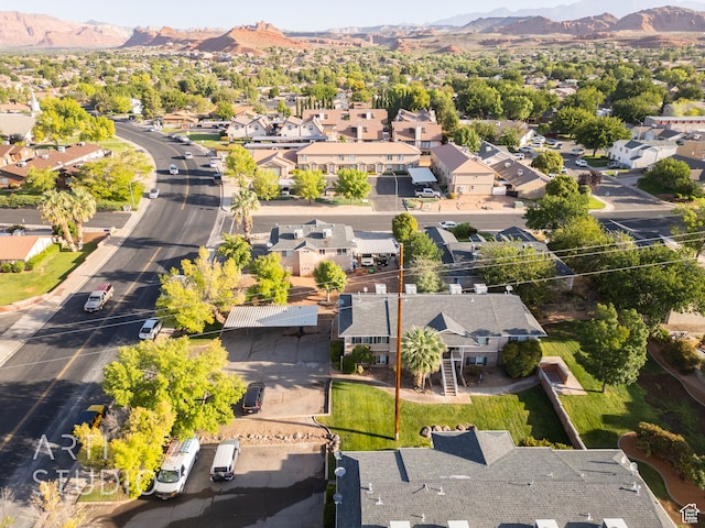 birds eye view of property with a mountain view