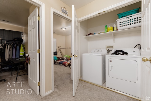 laundry room with light carpet and separate washer and dryer