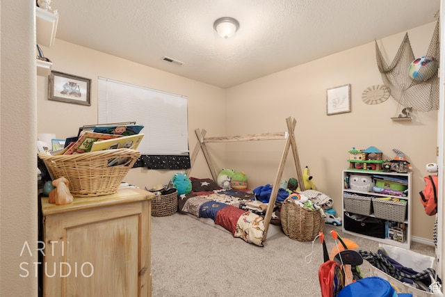 carpeted bedroom with a textured ceiling