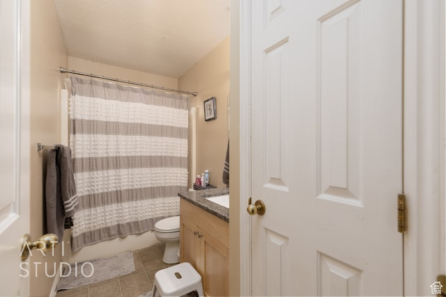 full bathroom with vanity, shower / tub combo with curtain, toilet, and tile patterned floors