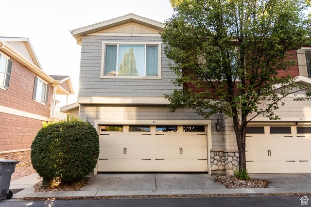 view of front of property featuring an attached garage and driveway
