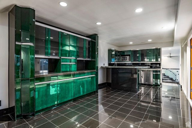 3809 E Thousand Oaks Cir, Salt Lake City, UT 84124 - kitchen featuring stainless steel appliances, recessed lighting, glass insert cabinets, and dark tile patterned flooring