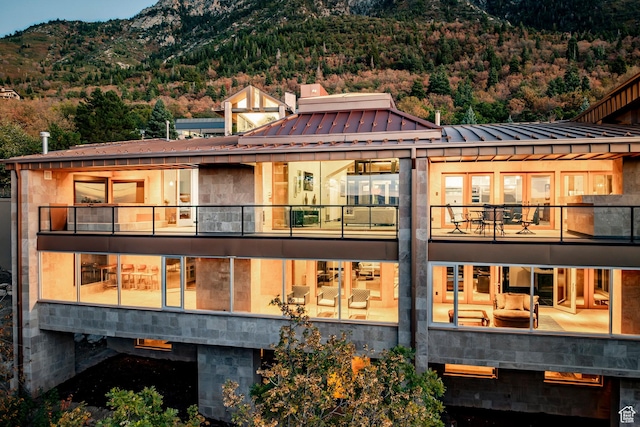3809 E Thousand Oaks Cir, Salt Lake City, UT 84124 - rear view of property with a mountain view, a balcony, and a metal roof