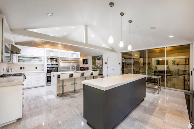 3809 E Thousand Oaks Cir, Salt Lake City, UT 84124 - kitchen with built in appliances, modern cabinets, a large island with sink, white cabinets, and lofted ceiling