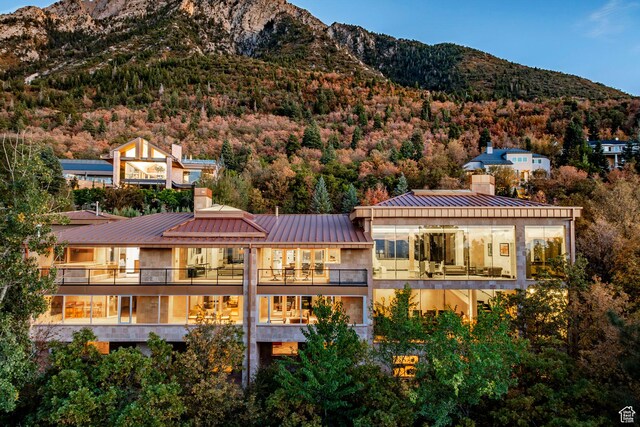 3809 E Thousand Oaks Cir, Salt Lake City, UT 84124 - rear view of property featuring a balcony, a chimney, a metal roof, and a mountain view