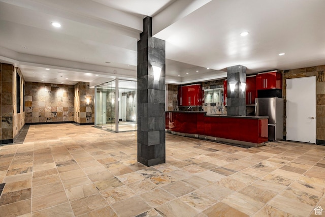 3809 E Thousand Oaks Cir, Salt Lake City, UT 84124 - kitchen with freestanding refrigerator, dark brown cabinets, wall chimney range hood, recessed lighting, and dark countertops