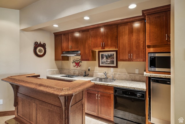 75 Hidden Oaks Ln, Park City, UT 84060 - kitchen with a sink, stainless steel appliances, under cabinet range hood, light stone countertops, and recessed lighting