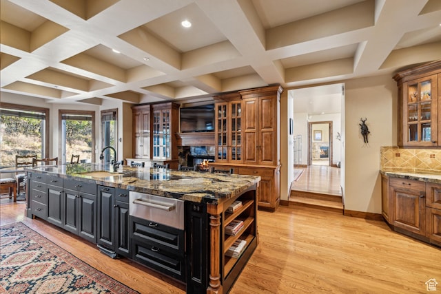 75 Hidden Oaks Ln, Park City, UT 84060 - kitchen featuring a warming drawer, coffered ceiling, a sink, and a kitchen island with sink