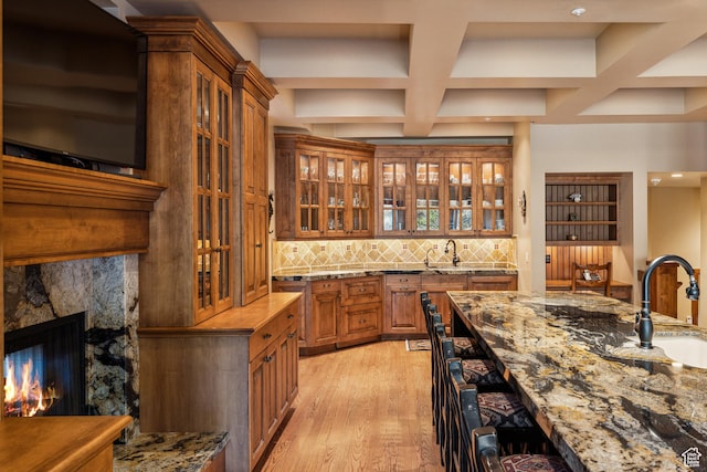 75 Hidden Oaks Ln, Park City, UT 84060 - bar with light wood finished floors, a sink, beam ceiling, tasteful backsplash, and coffered ceiling