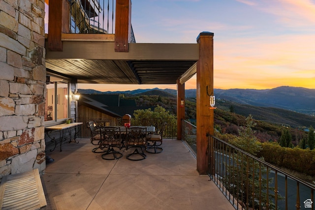 75 Hidden Oaks Ln, Park City, UT 84060 - patio terrace at dusk featuring a mountain view and outdoor dining area