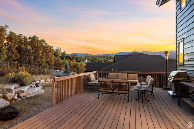 75 Hidden Oaks Ln, Park City, UT 84060 - deck at dusk with outdoor lounge area, grilling area, and a mountain view
