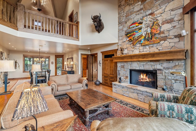 75 Hidden Oaks Ln, Park City, UT 84060 - living room featuring recessed lighting, wood finished floors, a fireplace, baseboards, and a high ceiling