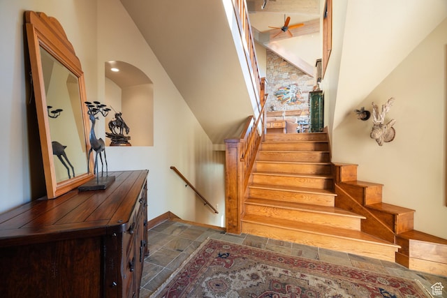 75 Hidden Oaks Ln, Park City, UT 84060 - staircase with stone finish floor, ceiling fan, arched walkways, baseboards, and vaulted ceiling