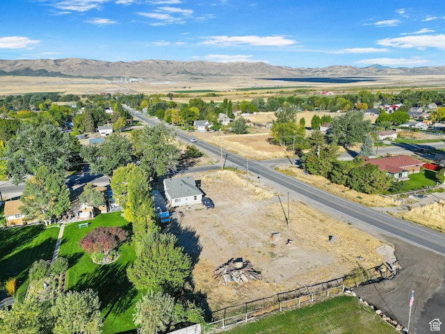 birds eye view of property with a mountain view