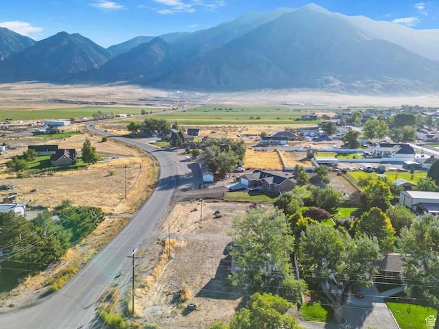 birds eye view of property featuring a mountain view