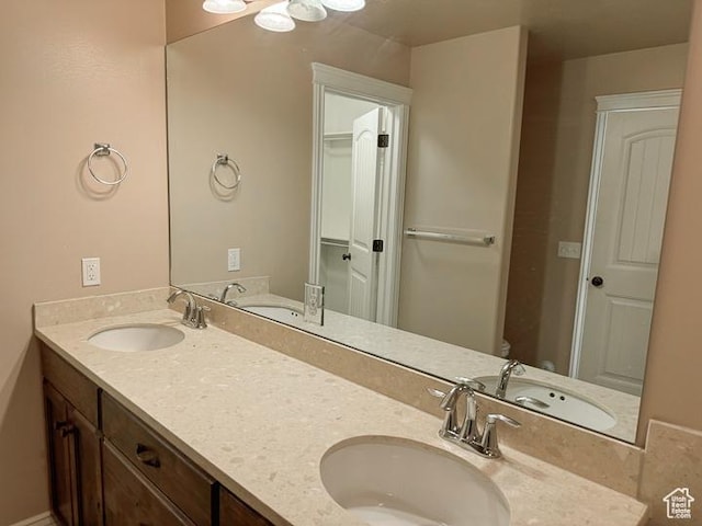 bathroom featuring double vanity and a sink