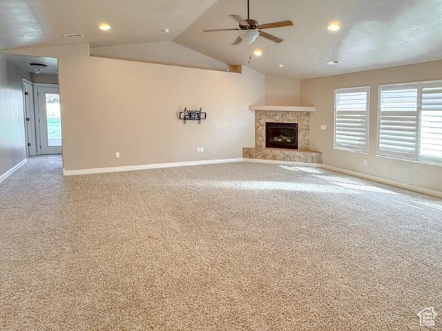 unfurnished living room with baseboards, carpet flooring, ceiling fan, and vaulted ceiling