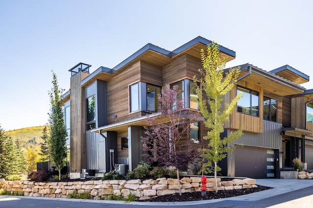 3576 Ridgeline Dr Unit 14-C, Park City, UT 84098 - view of front of property featuring a garage and a chimney