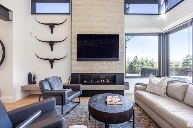 3576 Ridgeline Dr Unit 14-C, Park City, UT 84098 - living area with a fireplace, wood finished floors, and plenty of natural light