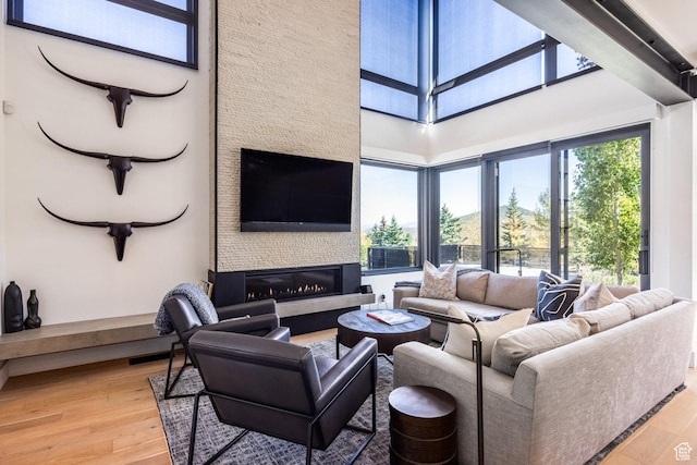 3576 Ridgeline Dr Unit 14-C, Park City, UT 84098 - living area featuring light wood-style flooring and a large fireplace