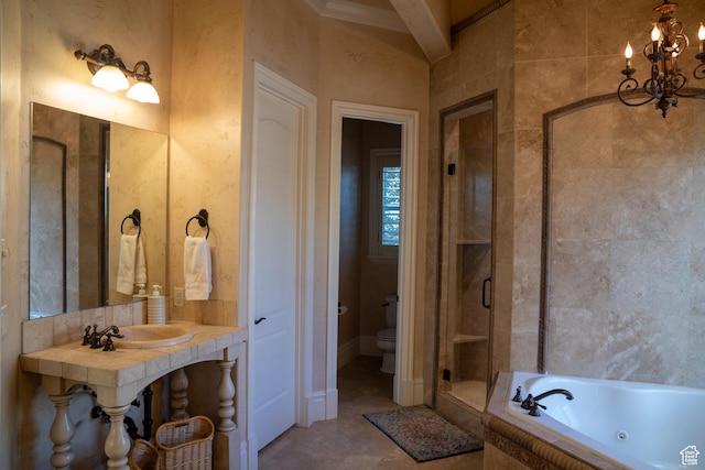 bathroom featuring an inviting chandelier, a sink, toilet, a shower stall, and a jetted tub